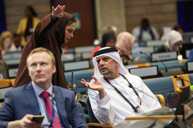 Delegates from Saudi Arabia conferring