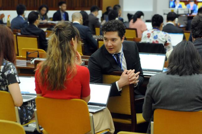Delegates from the Netherlands consult during the session