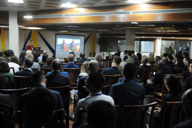 Participants watch a video during the side event