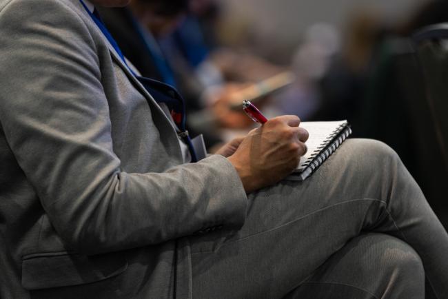 Delegate takes notes
