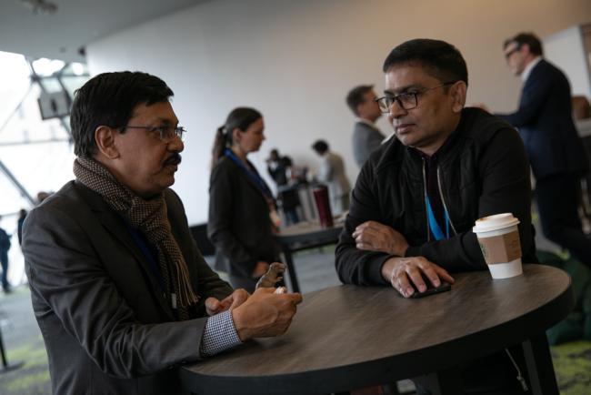 Shahriar Hossain, International Pollutants Elimination Network (IPEN), speaks with a delegate