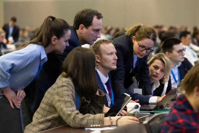 Delegates review the negotiating text