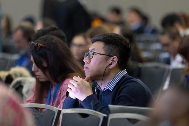 Delegates review the text