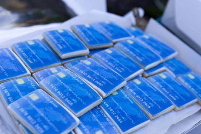 Members of civil society hand out 'credit card cookies', highlighting that every week, people consume up to 2,000 tiny pieces of plastics - equal to the weight of an average credit card