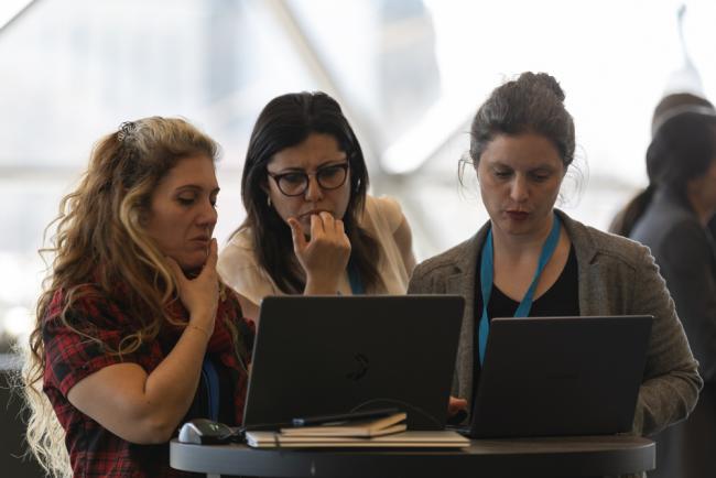 Delegates review streamlined versions of the text