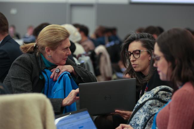 Delegates from Costa Rica consult
