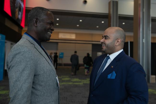 Delegates from Congo and Kuwait share a moment