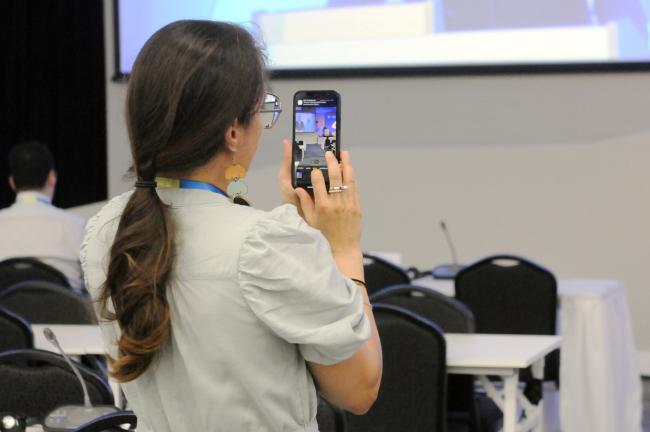 A participant takes a photo of Anders Adlercreutz, Minister for European Affairs and Ownership Steering, Finland