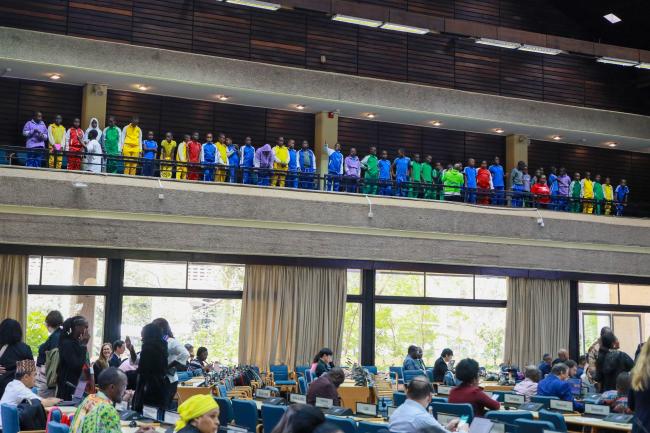 Students from a technical school, before the start of the morning plenary
