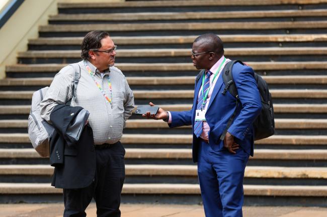 Scott Wilson, Canada, with Francis Ogwal, Uganda