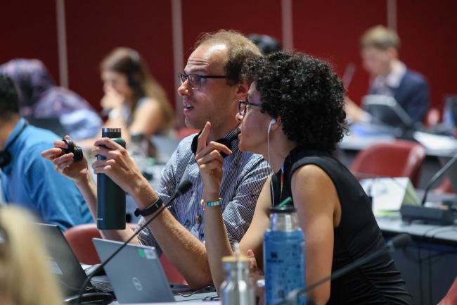 Canadian delegates in consultations during the session