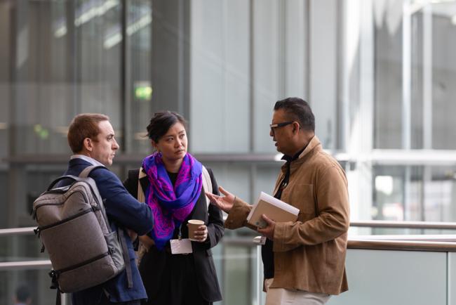 Co-Facilitators for the NGQC Zaheer Fakir, UAE, and Fiona Gilbert, Australia, speak with a delegate