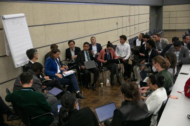 Delegates break out into groups to share ideas and perspectives