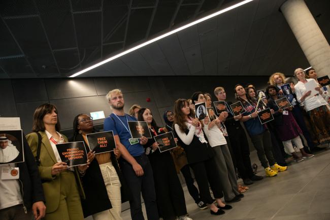 Members of civil society demonstrate in the corridors, calling for the great protection of environmental defenders, saying there is "no climate justice without civic justice"