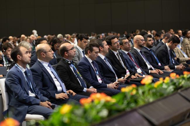 Members of the incoming COP 29 Presidency sit in the front row