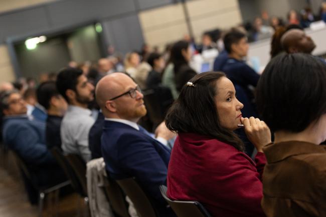 Delegates listen to the deliberations