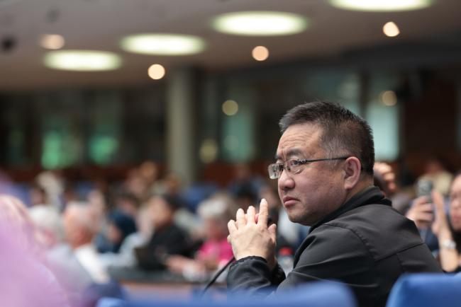 Delegates listen to the interventions