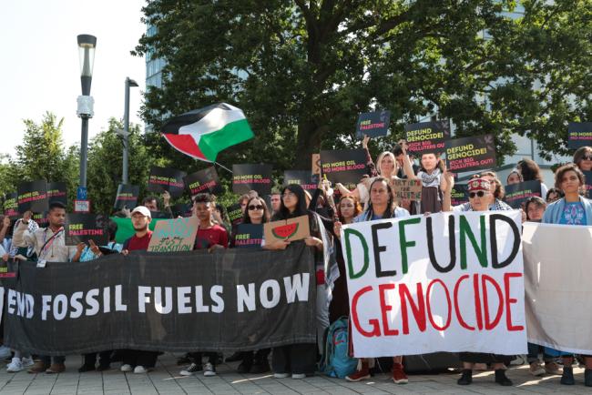 As the negotiations continue, members of civil society demonstrate outside the venue, calling for an end to fossil fuels and for a ceasefire in Palestine, highlighting that it is the same systems of oppression that created both the climate crisis and the genocide