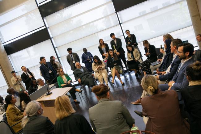 A spinoff group meets during the informal consultations on Article 6.8