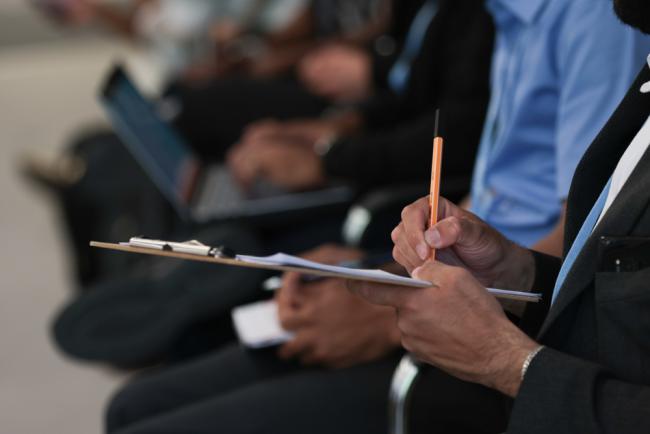 Delegate takes notes