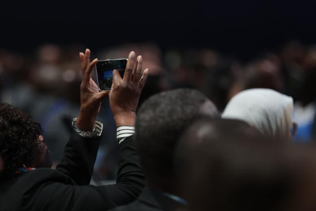 Delegate takes photo