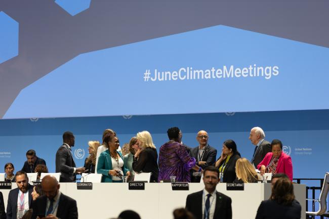 The UNFCCC Secretariat consults on the dais as issues are raised about the denial of visas for attending SB 60