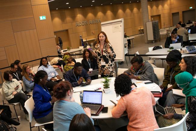 Participants work in breakout groups to discuss a number of topics
