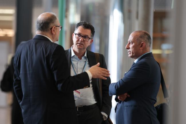 Youssef Nassef, UNFCCC Secretariat, speaks with Mohamed Nasr and  Wael Aboulmagd, Egypt
