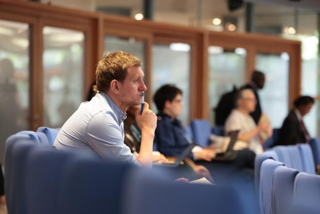 Delegates listen during the expert dialogue on children and climate change