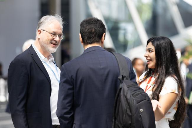 Paul Watkinson, France, speaks with delegates