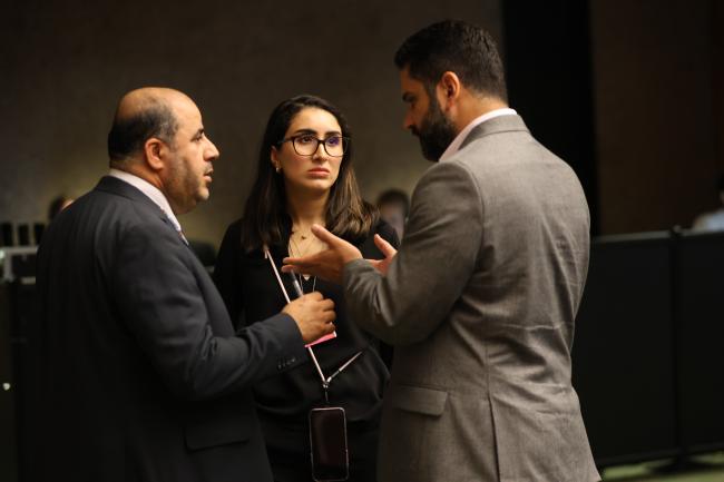 Delegates from Saudia Arabia conferring