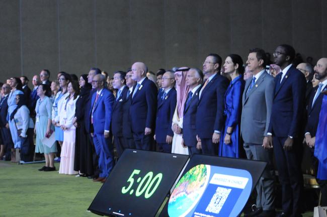 Participants stand for the national anthem of Costa Rica