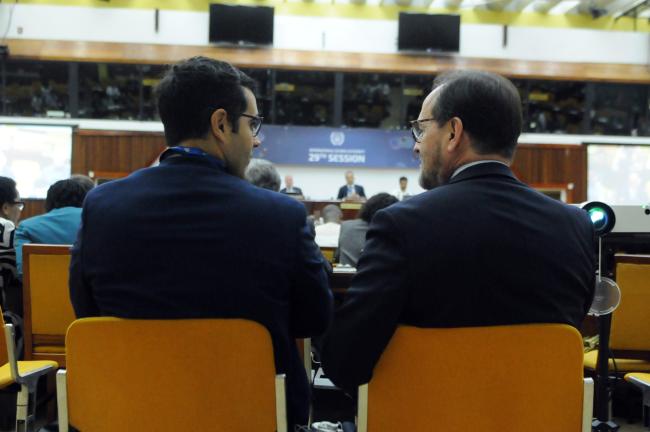 Delegates from Spain confer