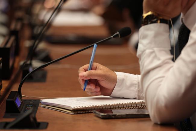 Delegate takes notes