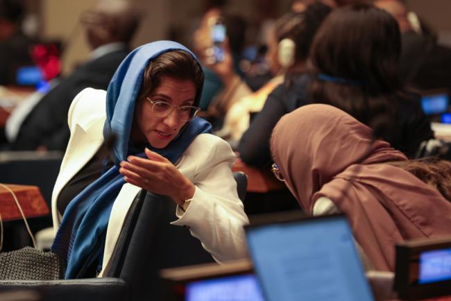 Delegates from Saudi Arabia consult