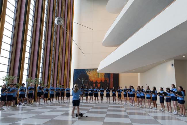 A children's choir performs in the lobby of UN Headquarters