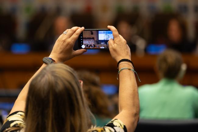Delegate takes a photo