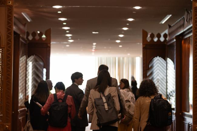 Delegates walk through the Delegates Lounge