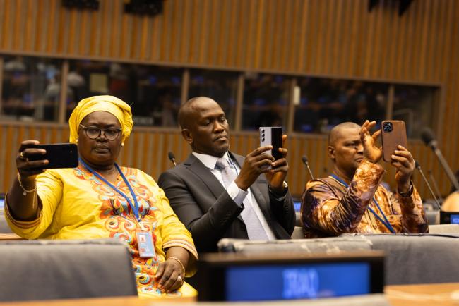 Delegates take photos