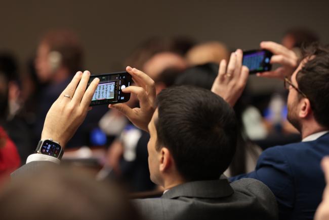 Delegates take photos of the voting results