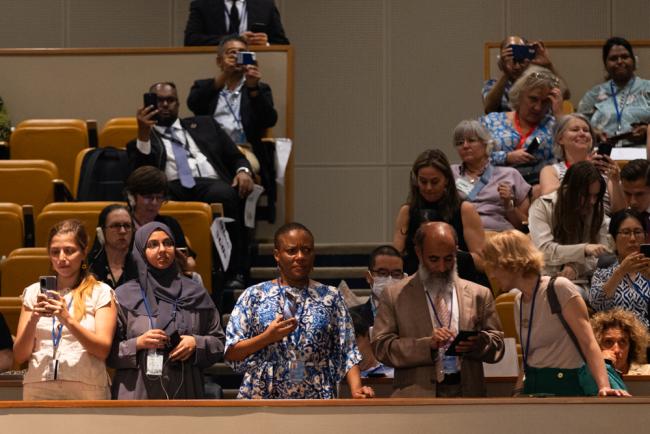 Delegates watch the proceedings from the gallery