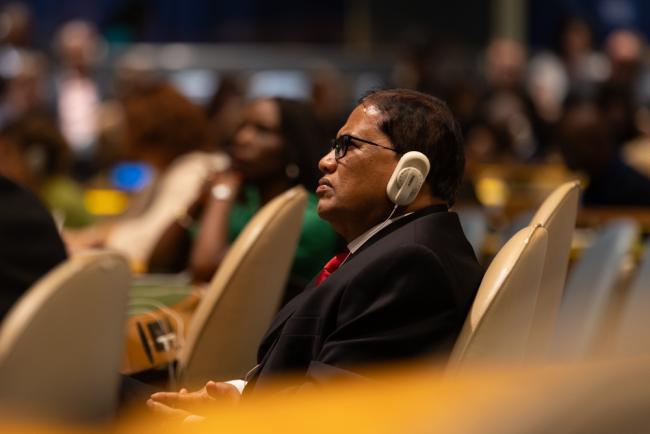 Delegates listen during the session