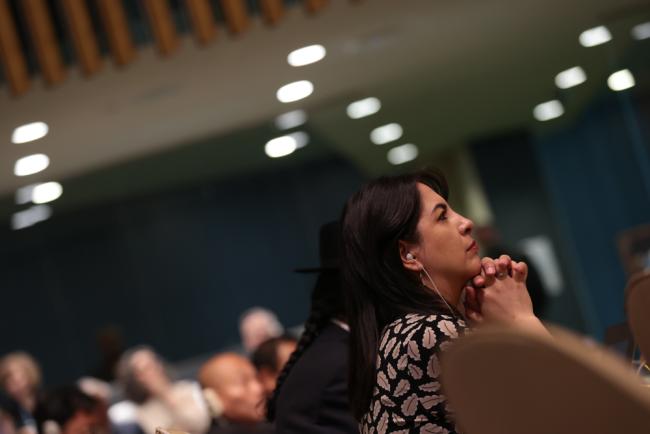 Delegates listen during the session