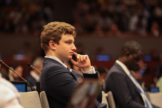 Delegates listen to the deliberations