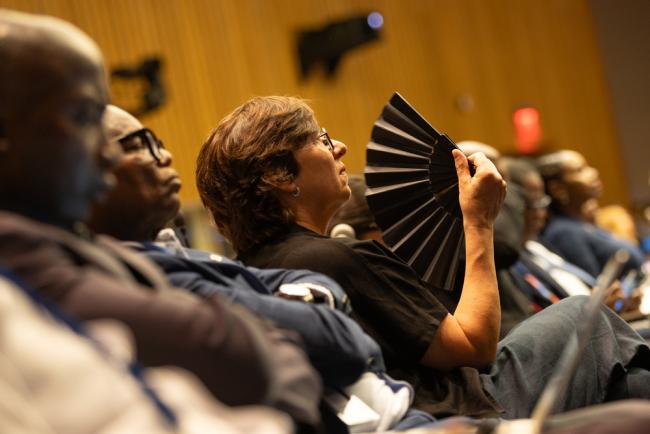 Delegate in session with fan