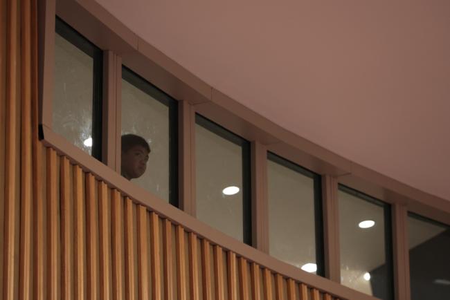 A young visitor to the UN watches the proceedings from the gallery
