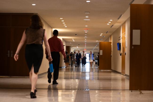 Delegates walk through the venue