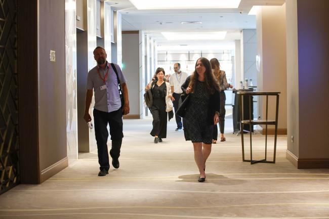 Delegates walking to the Contact Group on the outline of the Special Report on Climate Change and Cities