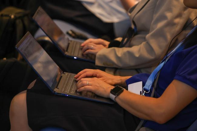 delegates taking notes