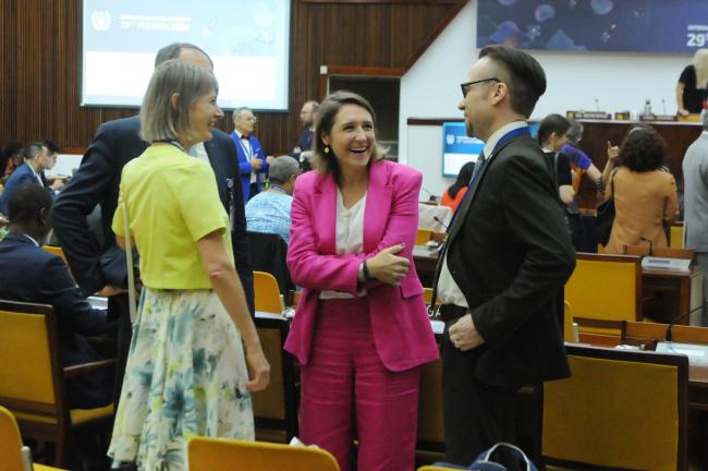 Marie Bourrel-McKinnon, ISA Secretariat, shares a laugh with delegates from the Russian Federation